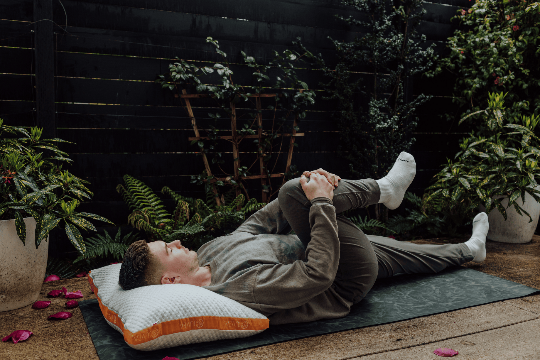 yoga stretching on deck with JUVEA pillow